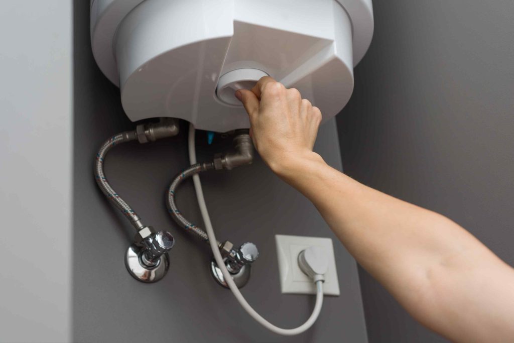 Professional technician inspecting a water heater